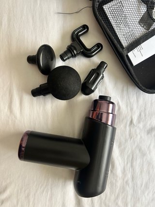 Pistola de masaje muscular