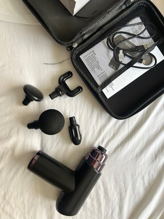 Pistola de masaje muscular