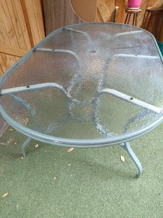 Mesa de jardín ovalada cristal y metal