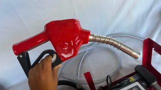 Bomba de repostaje con manguera