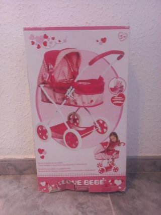 Cochecito de muñecas rosa