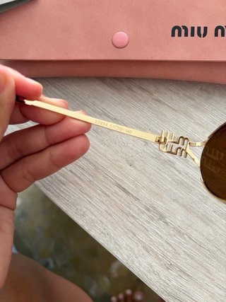 Gafas de sol Miu Miu doradas y marrones