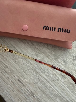 Gafas de sol Miu Miu doradas y marrones