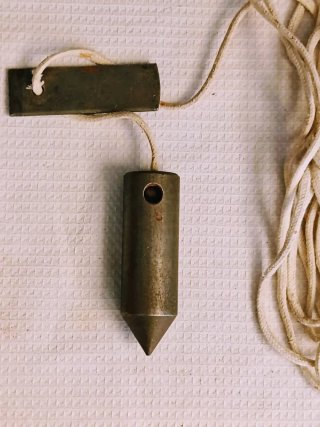 Plomada y paletas de albañil