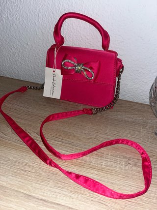 Bolso fiesta rosa Primark lazo pedrería