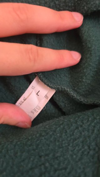 Sudadera verde con estampado de pluma