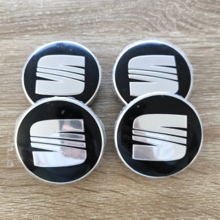TAPABUJES SEAT 63mm NEGROS CON EMBLEMA PLATA