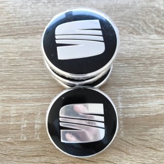 TAPABUJES SEAT 63mm NEGROS CON EMBLEMA PLATA