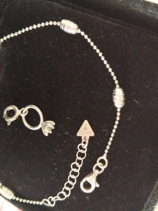 Pulsera y charm Guess Plata
