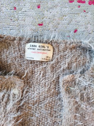 Chaqueta peluda gris 9-10 años