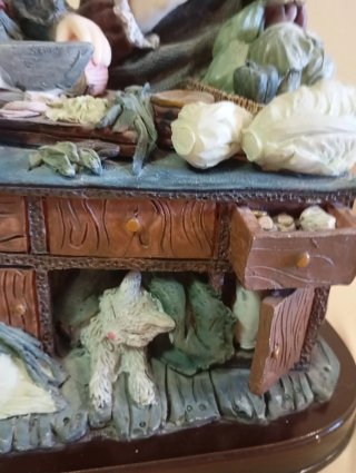 Figura decorativa de niñas cocinando