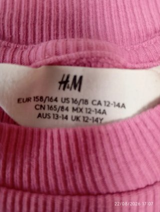 Top niña H&M rosa letras brillantes 14 años