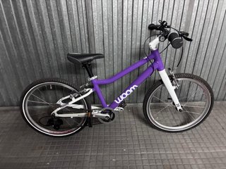 Bicicleta Woom 4 Morada. Como nueva.