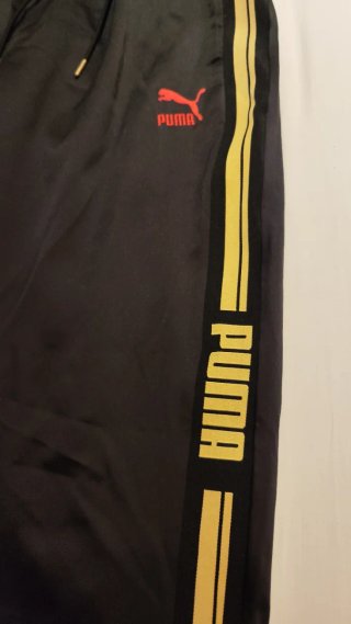 Pantalón chándal Puma negro y dorado