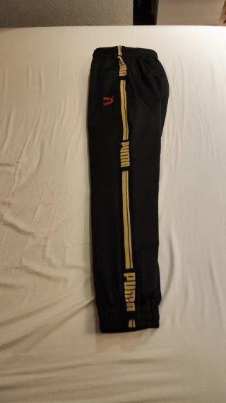 Pantalón chándal Puma negro y dorado