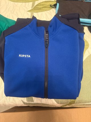 Chaqueta deportiva Kipsta azul y verde 10/11 años