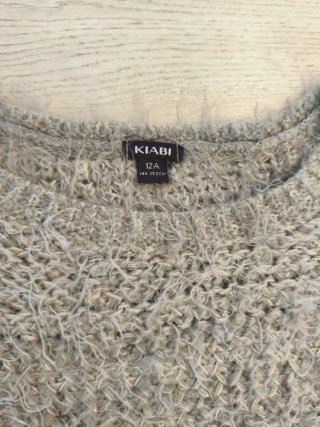 Sudadera gris peluda con estrella