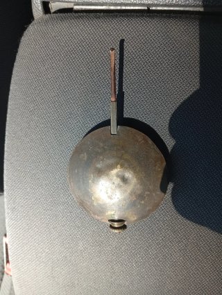 Péndulo de reloj antiguo