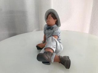 Figura niño Nadal durmiendo leyendo