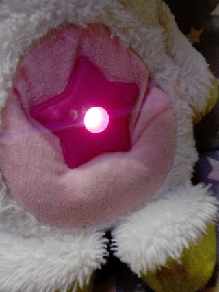 Peluches con proyector de luces y estrellas
