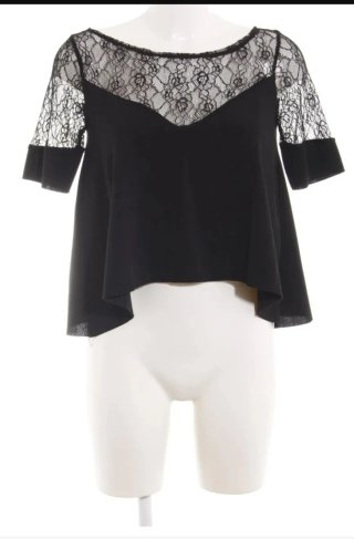 Blusa blanca de Zara combinada con Encaje