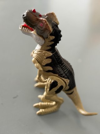 Dinosaurio con luz y sonido