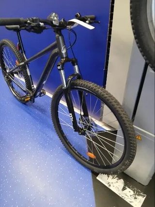 Bicicleta de montaña 29" Expl 100 gris suspensión delantera