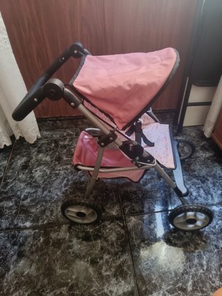 Carro de paseo para muñecas rosa