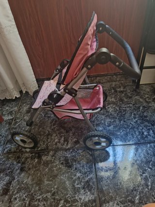 Carro de paseo para muñecas rosa