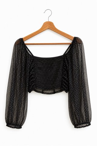 Top corto negro con topos dorados