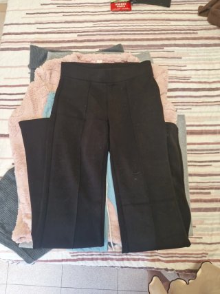 Pantalones grises acampanados de canalé