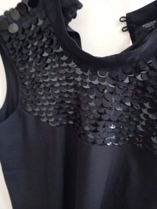 Blusa nera con paillettes