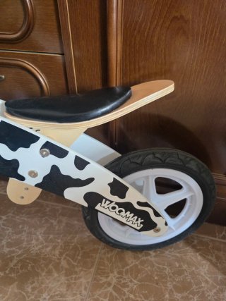 Bici de madera con diseño de vaca