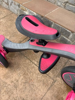Triciclo infantil rosa y gris