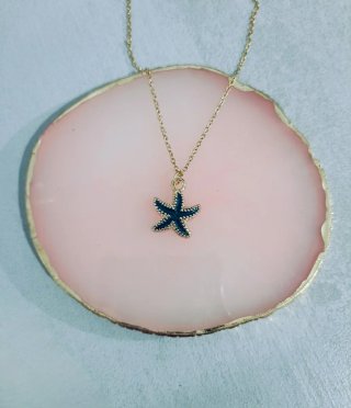 Colgante estrella de mar negro y dorado