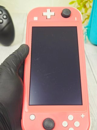 Nintendo Switch Lite Coral + Mando + Funda