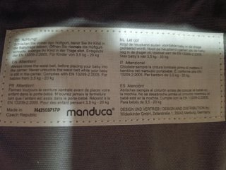 Portabebés Manduca ergonómico gris.