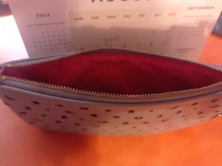 Cartera Tous gris con perforaciones