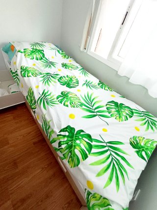 Fodera nordica con foglie tropicali verde e bianco
