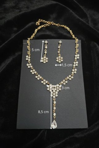 Conjunto collar y pendientes flores doradas brillo