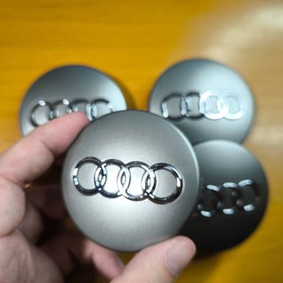 TAPABUJES AUDI 60mm GRIS - EMBLEMA LLANTAS AUDI