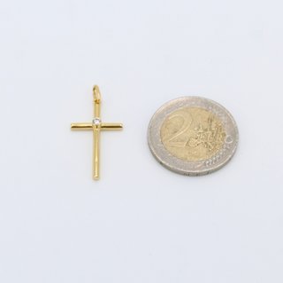Cruz de oro de 18k. Peso: 0.85 gr.