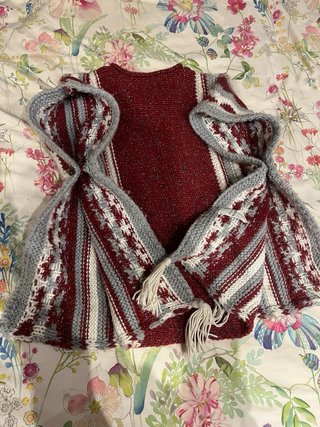Poncho de punto con flecos
