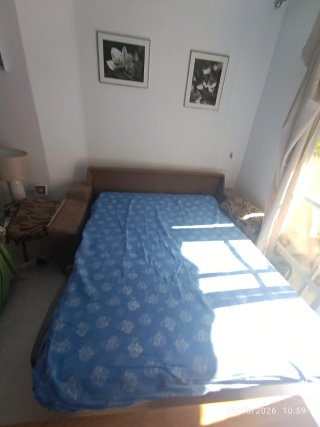 Sofá Cama Beige y Marrón en excelente estado.