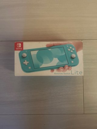 Nintendo Switch Lite azul con caja y funda