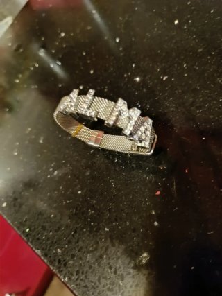 Pulsera de malla plateada con nombre "ALMA"