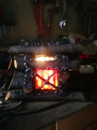 Chimenea eléctrica vintage troncos falsos.