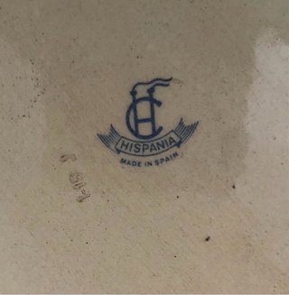 Perro de porcelana marrón y negro