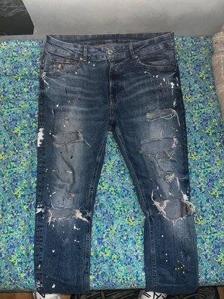 Pantaloni jeans uomo con strappi e macchie