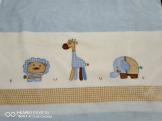Manta de cuna con animales.